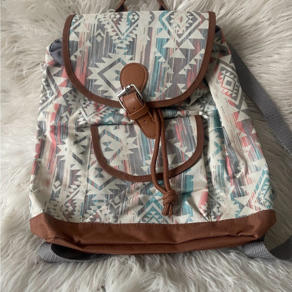 Geometric Patterned Backpack With Brown Accents - image 1